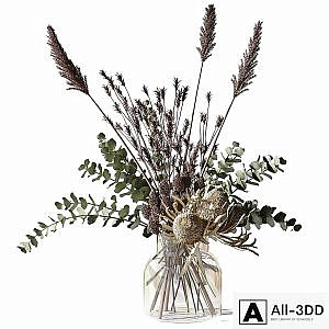 Bouquet with eucalyptus, bankxias and tall grass in a glass vase