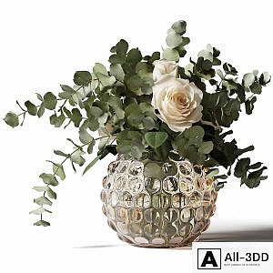 Bouquet of roses and eucalyptus in a glass pimpled vase