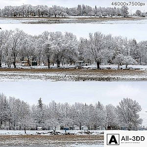 Panorama of the park with a lake and snow-covered trees. 46k