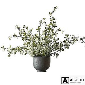 Bouquet of flowering branches in a clay vase